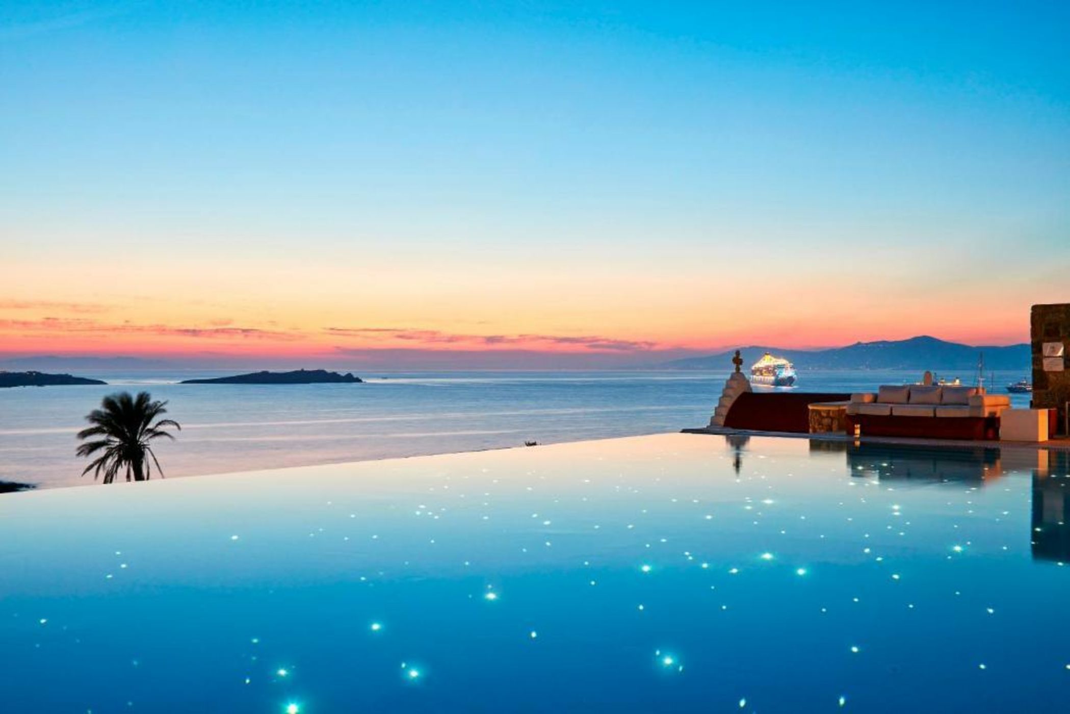 The infinity pool and sunset at Bill & Coo, Mykonos